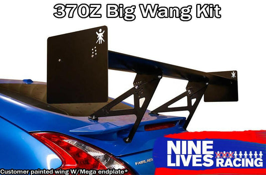 A blue sports car is depicted with a prominent black rear wing mounted on its trunk. Above the wing, the text reads "370z Big Wang Kit '08-20 Z34," while the bottom left corner states "Customer painted wing W/Mega endplate." The image highlights extruded aluminum wings designed for optimal down-force adjustments, and in the bottom right corner, there is a "9livesracing" logo.