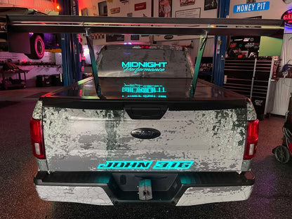 Ford F-150 with a Nine Lives Racing Big Wang Kit installed, showing a large chassis-mounted rear wing mounted above the truck bed.
