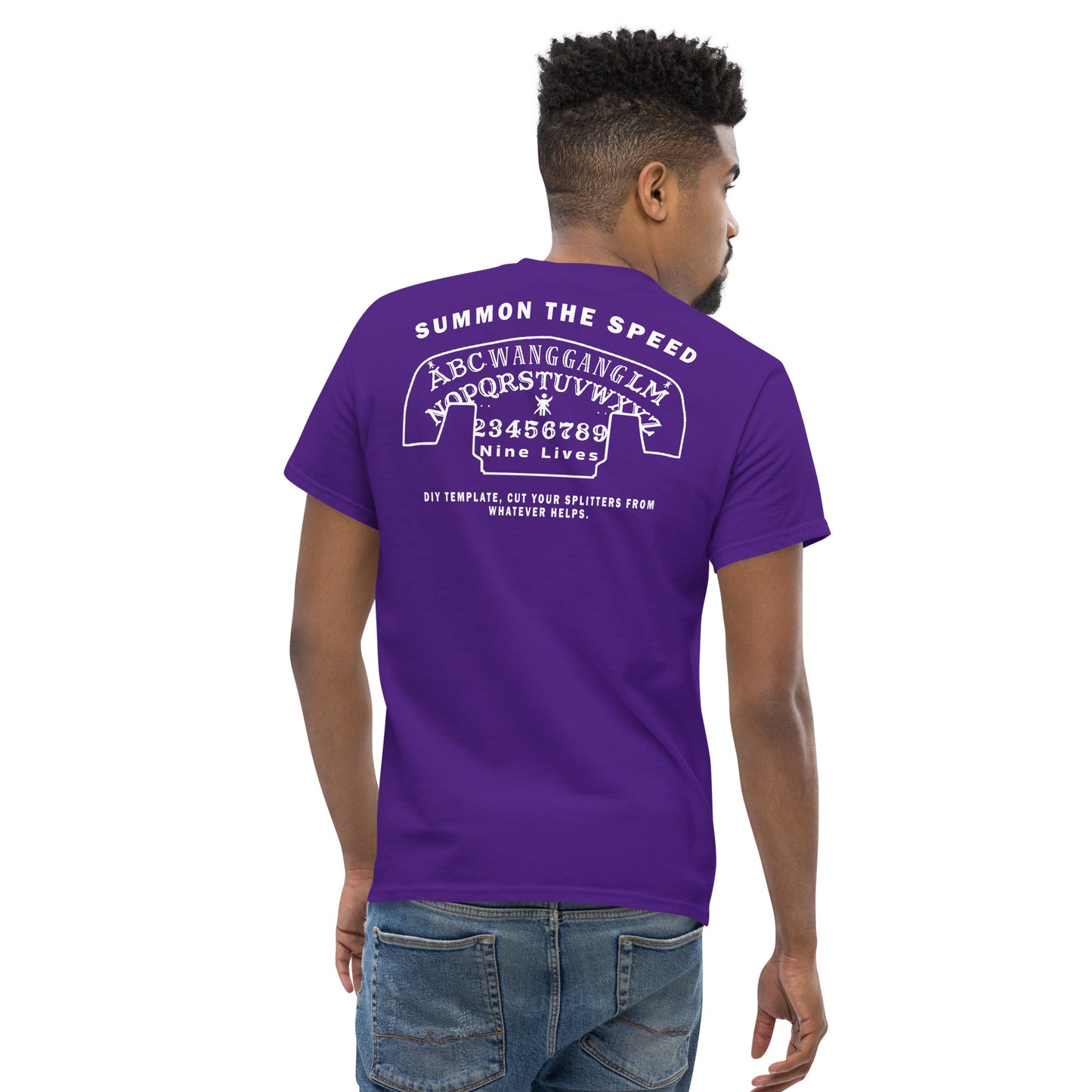 A man with short curly hair is seen from the back, donning a men's classic tee in purple and denim jeans. The Aerodynamics Is Witchcraft T shirt (ouija) from Nine Lives Racing is made of 100% cotton and features white text and a graphic resembling a Ouija board, with phrases like "SUMMON THE SPEED" and "NINE LIVES," making it a standout piece for streetwear outfits.