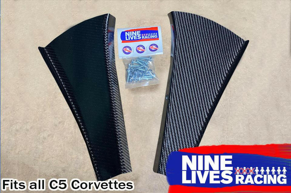 The image showcases two C5 Corvette Car-Nards from Nine Lives Racing, made of carbon fiber for improved aerodynamics, along with a small bag of screws and a Nine Lives Racing sticker. The brand's blue and white logo is visible in the bottom right corner. Text reads "Fits all C5 Corvettes." These components are part of their High Downforce kits.