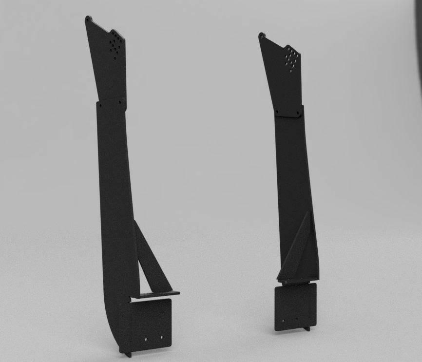 Two tall, black metal brackets branded as Corvette C5/C6 Mounts - Pylons Only by 9livesracing stand upright against a plain gray background. Designed specifically for Nine Lives Racing and compatible with C5/C6 Corvettes, each bracket features several bolted joints and perforated holes, with a triangular support structure near the middle. The symmetrical designs suggest an industrial purpose.