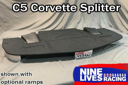 A black Corvette Medium Downforce Kit ‘97-04 C5, displayed on a cloth-covered surface, is shown with optional ramps. The text reads "Corvette Medium Downforce Kit ‘97-04 C5" at the top and "9livesracing" at the bottom with a logo in blue, white, and red. This aerodynamic kit is designed to enhance downforce.