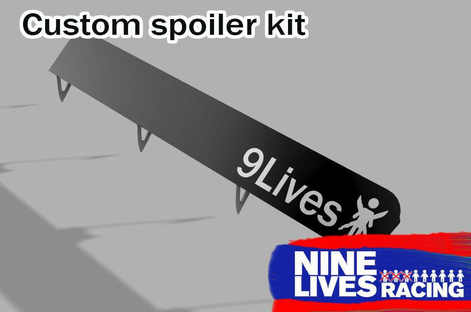 Image of a "9 Lives" custom spoiler kit featuring a small angel figure print. In the bottom right corner, there’s a logo with the text "9livesracing" on a blue and red background. The AOA adjustable design ensures optimal downforce adjustment for peak performance.