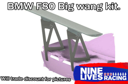 Image of a large rear wing kit designed for BMW F80, F82, and F83 cars from 2014 to 2018. The kit features a prominently large and flat spoiler supported by sturdy side brackets. This 3-Series Big Wang GT3 kit, made by 9livesracing with extruded aluminum wings, dramatically increases downforce. Text includes "BMW F80 Big wang kit," "Will trade discount for pictures," and a "9livesracing" logo.
