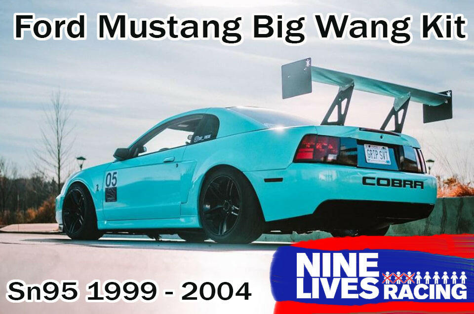 A blue Ford Mustang with a large rear wing spoiler kit attached, labeled with 'Nine Lives Racing' and the model years '99-04 SN95'.