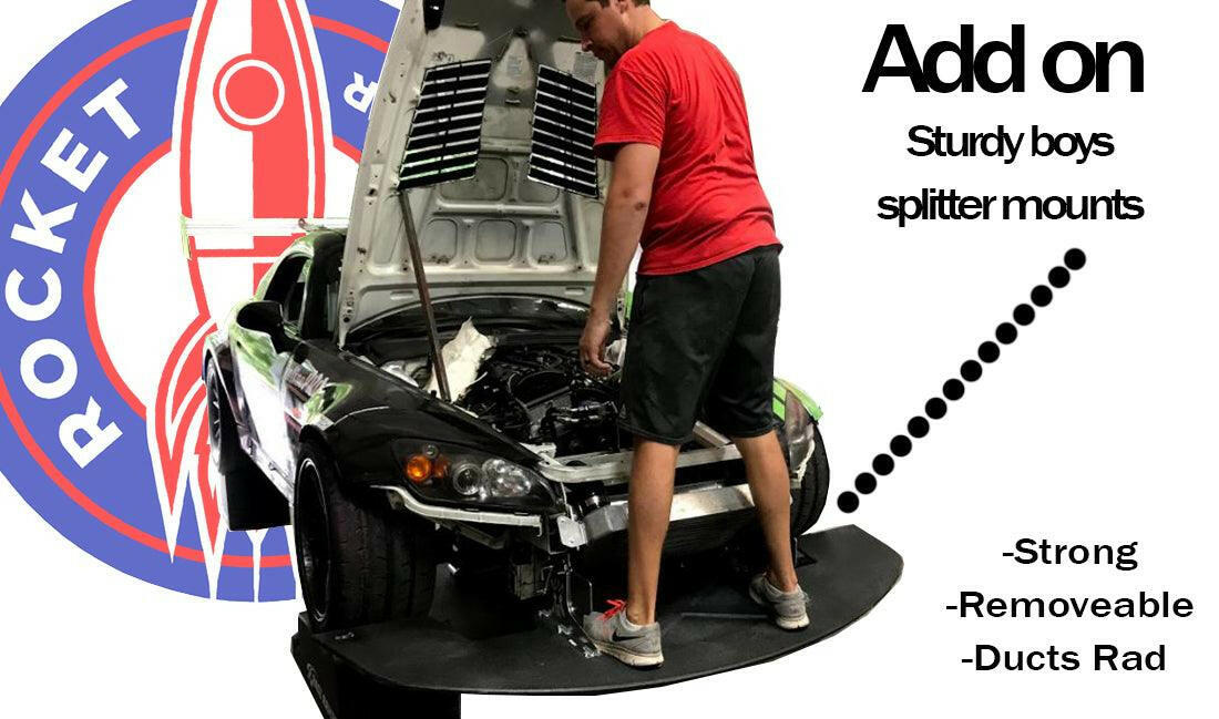 A person in a red shirt and black shorts stands on the carbon fiber splitter of a car with its hood open. Text on the right reads: "Add on 9livesracing S2000 Rocket Nose Splitter '99-09 - Strong - Removable - Ducts Rad." A large logo with a rocket is visible on the left.