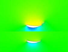 A computational fluid dynamics simulation image showcasing airflow over an American-made 9livesracing Deuce! Double Element Kit wing. The top and bottom images illustrate velocity contours with various colors indicating different flow speeds, predominantly featuring green, yellow, and blue.